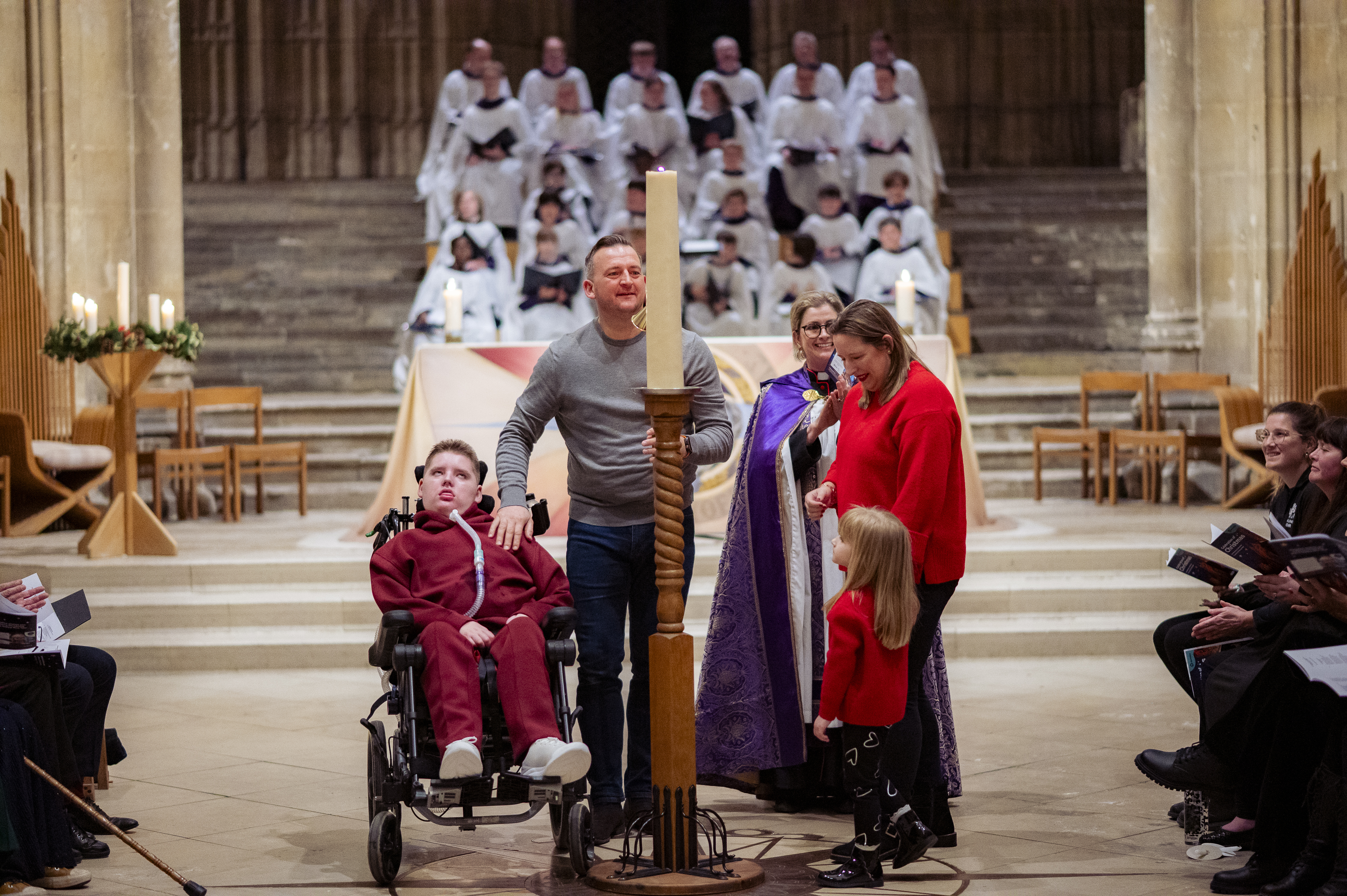 Family lighting the candle at Canterbury Cathedral