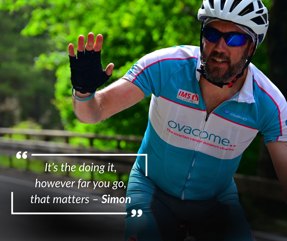 A cyclist in ovacome branded top with a motivational quote