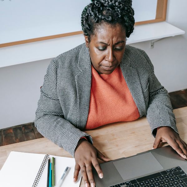 Woman sitting at a desk with a laptop