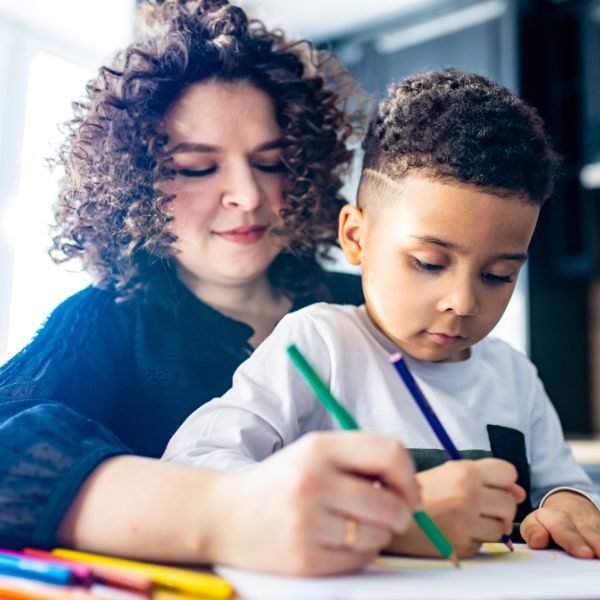 A woman with her young son on her lap