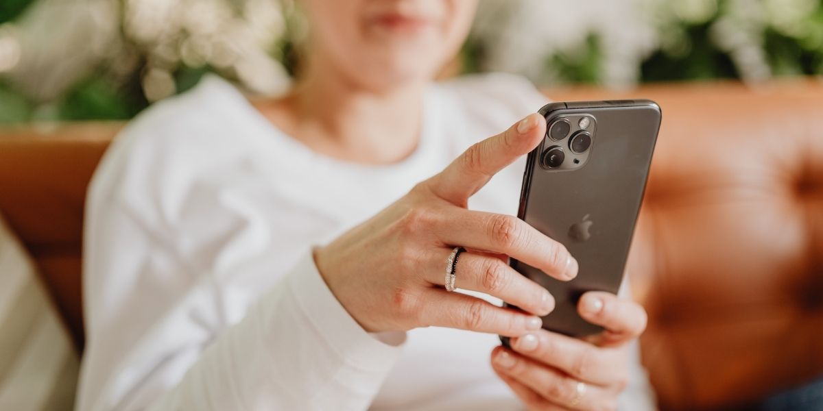 woman holding iPhone